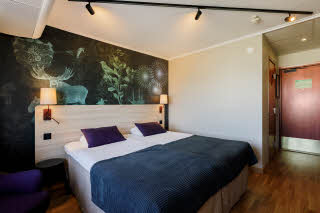 Foto: David Thunander Beds in room superior